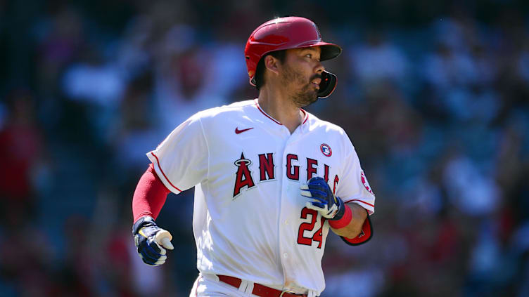 Jul 4, 2021; Anaheim, California, USA; Los Angeles Angels catcher Kurt Suzuki (24) reaches first