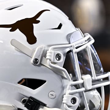 Nov 30, 2024; College Station, Texas, USA; A detail view of a Texas Longhorns helmet on the sideline during the first quarter against the Texas A&M Aggies. The Longhorns defeated the Aggies 17-7 at Kyle Field. Mandatory Credit: Maria Lysaker-Imagn Images  