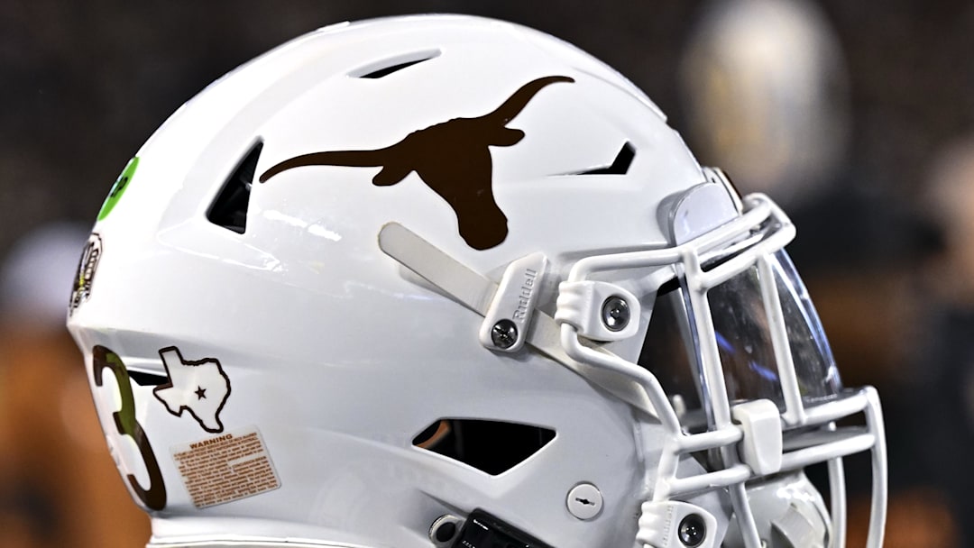 Nov 30, 2024; College Station, Texas, USA; A detail view of a Texas Longhorns helmet on the sideline during the first quarter against the Texas A&M Aggies. The Longhorns defeated the Aggies 17-7 at Kyle Field. Mandatory Credit: Maria Lysaker-Imagn Images  