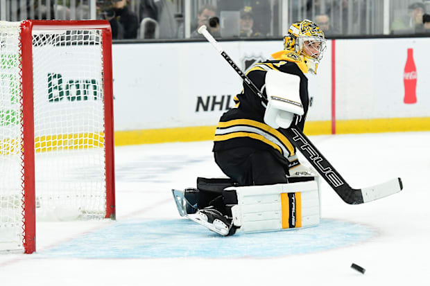 Hockey goalie in black unifor