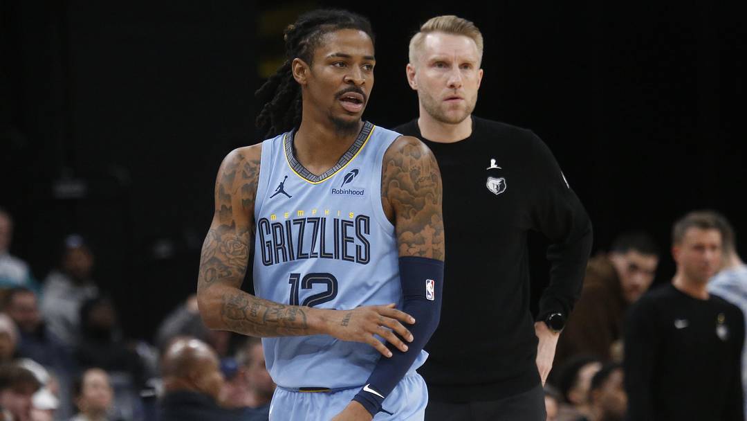 Jan 21, 2026; Memphis, Tennessee, USA; Memphis Grizzlies guard Ja Morant (12) and head coach Tuomas Iisalo looks on during the third quarter against the Atlanta Hawks at FedExForum. Mandatory Credit: Petre Thomas-Imagn Images