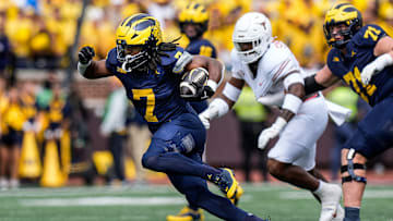 Michigan running back Donovan Edwards (7) runs for a first down against Texas during the first half at Michigan Stadium in Ann Arbor on Saturday, September 7, 2024.