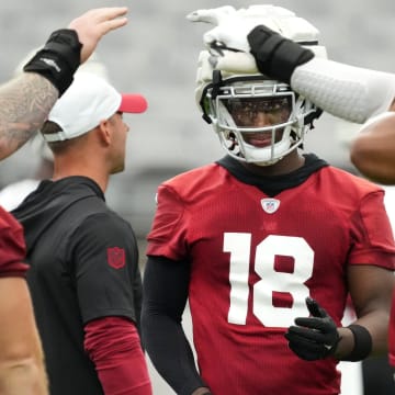 Arizona Cardinals receiver Marvin Harrison Jr. (18) enters the offensive huddle during training camp at State Farm Stadium in Glendale on July 25, 2024.