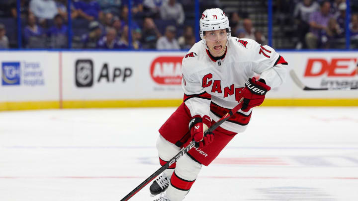 Sep 29, 2023; Tampa, Florida, USA;  Carolina Hurricanes right wing Jesper Fast (71) controls the puck against the Tampa Bay Lightning in the first period during preseason at Amalie Arena. Mandatory Credit: Nathan Ray Seebeck-USA TODAY Sports