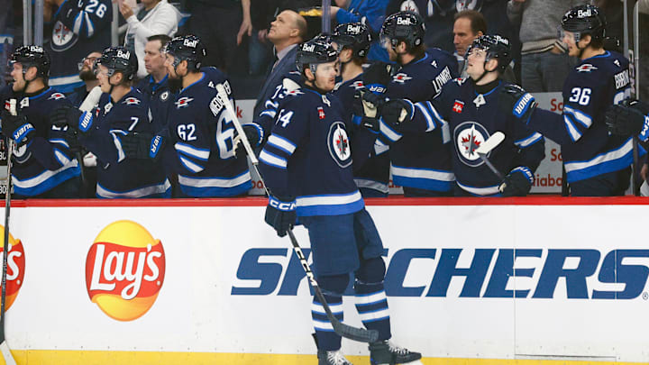 Mar 14, 2025; Winnipeg, Manitoba, CAN; Winnipeg Jets defenseman Dylan Samberg (54) is congratulated by his team mates on his goal against the Dallas Stars during the second period at Canada Life Centre. Mandatory Credit: Terrence Lee-Imagn Images Mar 14, 2025; Winnipeg, Manitoba, CAN; Winnipeg Jets defenseman Dylan Samberg (54) is congratulated by his team mates on his goal against the Dallas Stars during the second period at Canada Life Centre. Mandatory Credit: Terrence Lee-Imagn Images