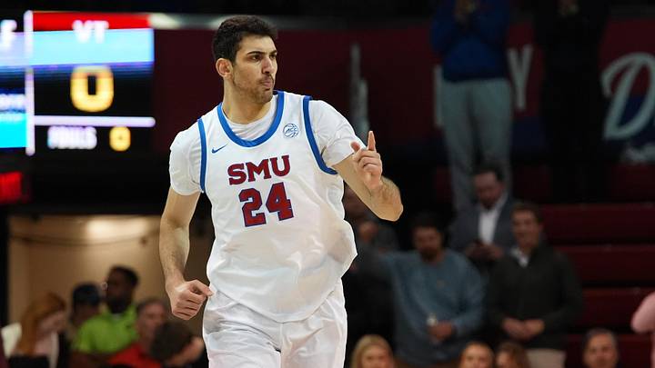 Jan 14, 2026; Dallas, Texas, USA;  SMU Mustangs center Samet Yigitoglu (24) reacts after a made basket as he runs up court against the Virginia Tech Hokies during the first half at Moody Coliseum. Mandatory Credit: Raymond Carlin III-Imagn Images