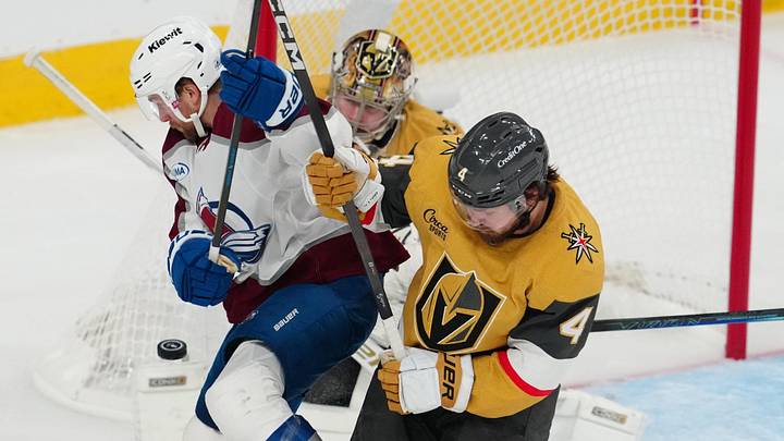 May 26, 2026; Las Vegas, Nevada, USA; Vegas Golden Knights defenseman Rasmus Andersson (4) and goaltender Carter Hart (79) defend against the Colorado Avalanche during the third period in game four of the Western Conference Final of the 2026 Stanley Cup Playoffs at T-Mobile Arena. Mandatory Credit: Stephen R. Sylvanie-Imagn Images