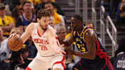 Apr 28, 2025; San Francisco, California, USA; Houston Rockets center Alperen Sengun (28) controls the ball against Golden State Warriors forward Draymond Green (23) during the second quarter of game four of the 2025 NBA Playoffs first round at Chase Center. Mandatory Credit: Kelley L Cox-Imagn Images