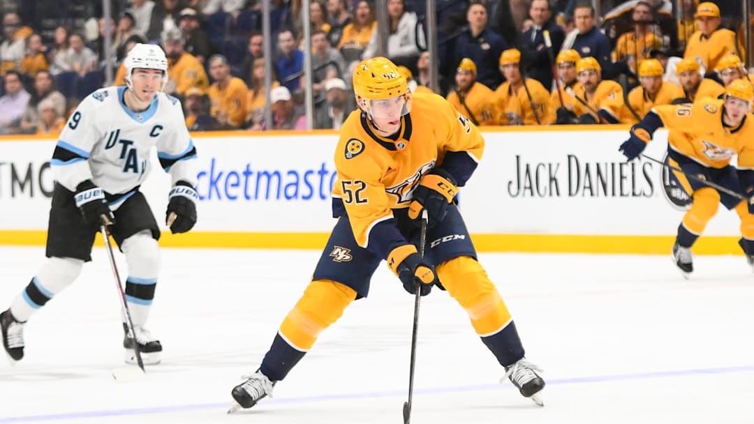 Apr 14, 2025; Nashville, Tennessee, USA;  Nashville Predators right wing Matthew Wood (52)  skates with the puck against the Utah Hockey Club during the third period at Bridgestone Arena. Mandatory Credit: Steve Roberts-Imagn Images