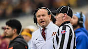 Oct 25, 2025; Iowa City, Iowa, USA; Minnesota Golden Gophers head coach P.J. Fleck reacts near a referee during the first quarter against the Iowa Hawkeyes at Kinnick Stadium. Mandatory Credit: Jeffrey Becker-Imagn Images