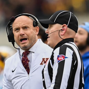 Oct 25, 2025; Iowa City, Iowa, USA; Minnesota Golden Gophers head coach P.J. Fleck reacts near a referee during the first quarter against the Iowa Hawkeyes at Kinnick Stadium. Mandatory Credit: Jeffrey Becker-Imagn Images