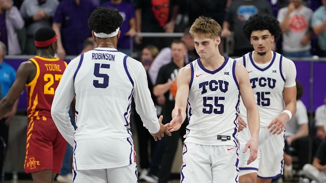 Feb 10, 2026; Fort Worth, Texas, USA;  TCU Horned Frogs guard Tanner Toolson (55) and forward Micah Robinson (5) react after the game against the Iowa State Cyclones at Ed and Rae Schollmaier Arena. Mandatory Credit: Raymond Carlin III-Imagn Images