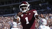 Mississippi State Bulldogs quarterback Kamario Taylor (1) celebrates after scoring a touchdown against the Mississippi Rebels in the first half at Davis Wade Stadium at Scott Field.