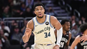 Nov 29, 2025; Milwaukee, Wisconsin, USA; Milwaukee Bucks forward Giannis Antetokounmpo (34) reacts after scoring his 21,000th career point in the third quarter against the Brooklyn Nets at Fiserv Forum. Mandatory Credit: Benny Sieu-Imagn Images