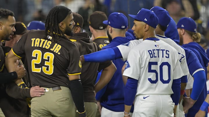 San Diego Padres right fielder Fernando Tatis Jr. (23) and Los Angeles Dodgers shortstop Mookie Betts (50) engage on the field after benches cleared in the eighth inning at Dodger Stadium on June 19. San Diego Padres right fielder Fernando Tatis Jr. (23) and Los Angeles Dodgers shortstop Mookie Betts (50) engage on the field after benches cleared in the eighth inning at Dodger Stadium on June 19.