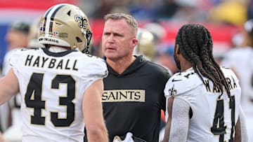 Dec 8, 2024; East Rutherford, New Jersey, USA; New Orleans Saints head coach Darren Rizzi talks with punter Matthew Hayball (43) and running back Alvin Kamara (41) during the first half against the New York Giants at MetLife Stadium. Mandatory Credit: Vincent Carchietta-Imagn Images