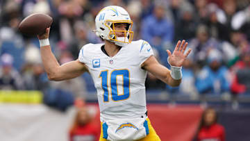 Dec 28, 2024; Foxborough, Massachusetts, USA; Los Angeles Chargers quarterback Justin Herbert (10) passes the ball against the New England Patriots in the first quarter at Gillette Stadium. Mandatory Credit: David Butler II-Imagn Images