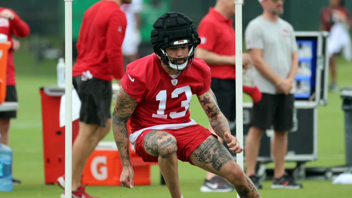 Jul 25, 2024; Tampa, FL, USA;  Tampa Bay Buccaneers wide receiver Mike Evans (13) works out during training camp at AdventHealth Training Center. Mandatory Credit: Kim Klement Neitzel-USA TODAY Sports