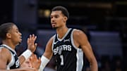 Oct 13, 2025; Indianapolis, Indiana, USA; San Antonio Spurs forward/guard Keldon Johnson (3) and forward/center Victor Wembanyama (1) celebrate a made basket in the second half against the Indiana Pacers at Gainbridge Fieldhouse. Mandatory Credit: Trevor Ruszkowski-Imagn Images