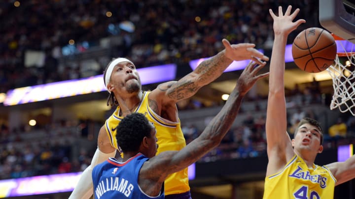 October 6, 2018; Los Angeles, CA, USA; Los Angeles Lakers forward Michael Beasley (11) and center Ivica Zubac (40) defend against Los Angeles Clippers guard Lou Williams (23) during the first half at Honda Center. Mandatory Credit: Gary A. Vasquez-USA TODAY Sports