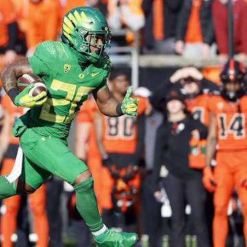 Nov 26, 2022; Corvallis, Oregon, USA; Oregon Ducks running back Jordan James (20) runs with the ball during the first half against the Oregon State Beavers at Reser Stadium. Mandatory Credit: Soobum Im-Imagn Images