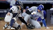 Jun 9, 2024; Bronx, New York, USA; Los Angeles Dodgers designated hitter Shohei Ohtani (17) scores ahead of the tag by New York Yankees catcher Jose Trevino (39) on a sacrifice fly by Dodgers catcher Will Smith (not pictured) during the eighth inning at Yankee Stadium. 