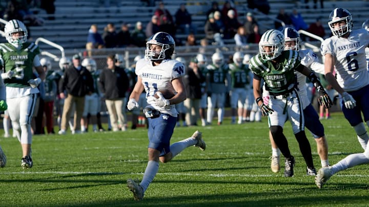 Nantucket's Arann Hanlon comes runs to the end zone for a first quarter touchdown. Dennis-Yarmouth Regional High School in South Yarmouth hosted Nantucket High School in football action Friday night. Nantucket defeated DY 49-22.