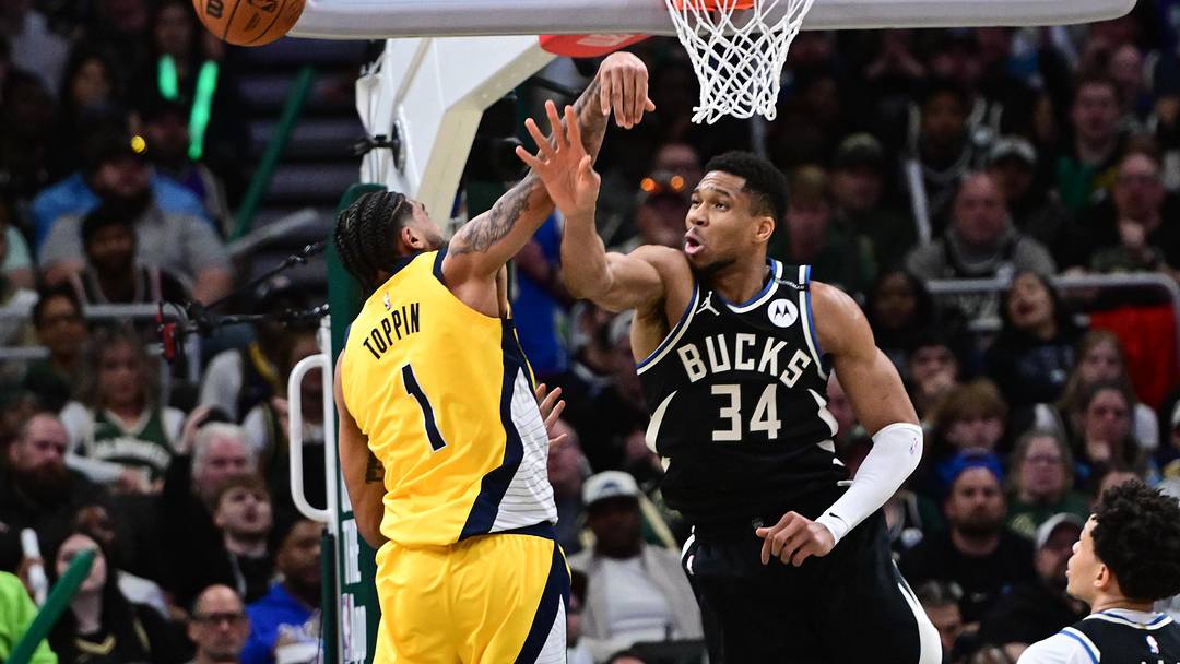 Apr 27, 2025; Milwaukee, Wisconsin, USA; Milwaukee Bucks forward Giannis Antetokounmpo (34) and Indiana Pacers forward Obi Toppin (1) reach for the ball in the third quarter during game four of first round for the 2024 NBA Playoffs at Fiserv Forum. Mandatory Credit: Benny Sieu-Imagn Images Apr 27, 2025; Milwaukee, Wisconsin, USA; Milwaukee Bucks forward Giannis Antetokounmpo (34) and Indiana Pacers forward Obi Toppin (1) reach for the ball in the third quarter during game four of first round for the 2024 NBA Playoffs at Fiserv Forum. Mandatory Credit: Benny Sieu-Imagn Images
