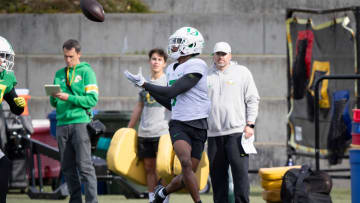 Oregon wide receiver Evan Stewart hauls in a pass during practice with the Ducks Thursday, April 11, 2024, at the Hatfield-Dowlin Complex in Eugene, Ore.