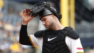 Aug 8, 2024; Pittsburgh, Pennsylvania, USA;  Pittsburgh Pirates catcher Joey Bart (14) returns behind the plate against the San Diego Padres during the seventh inning at PNC Park. Mandatory Credit: Charles LeClaire-USA TODAY Sports