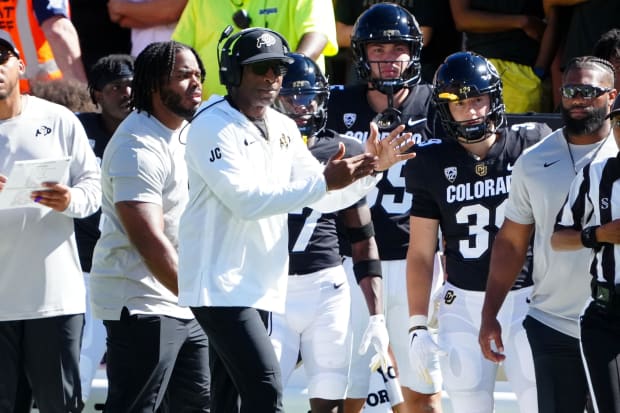 Colorado Buffaloes head coach Deion Sanders calls a timeout against the Nebraska Cornhuskers