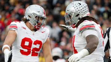 Ohio State Buckeyes defensive end Caden Curry (92) and Ohio State Buckeyes defensive tackle Tyleik Williams (91) celebrate a defensive stop during the NCAA football game against the Purdue Boilermakers, Saturday, Oct. 14, 2023, at Ross-Ade Stadium in West Lafayette, Ind. Ohio State Buckeyes won 41-7.