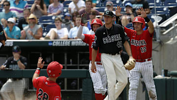 Jun 30, 2016; Omaha, NE, USA; Arizona Wildcats third baseman Kyle Lewis (28) scores during the sixth inning against the Coastal Carolina Chanticleers in game three of the College World Series championship series at TD Ameritrade Park. Mandatory Credit: Bruce Thorson-Imagn Images