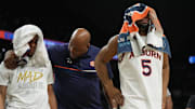 Apr 5, 2025; San Antonio, TX, USA;  Auburn Tigers forward Chris Moore (5) reacts as he comes off the court after losing to the Florida Gators in the semifinals of the men's Final Four of the 2025 NCAA Tournament at the Alamodome. Mandatory Credit: Robert Deutsch-Imagn Images