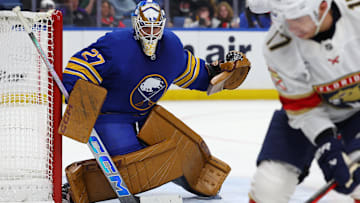 Oct 12, 2024; Buffalo, New York, USA;  Buffalo Sabres goaltender Devon Levi (27) looks for the puck during the third period against the Florida Panthers at KeyBank Center. Mandatory Credit: Timothy T. Ludwig-Imagn Images