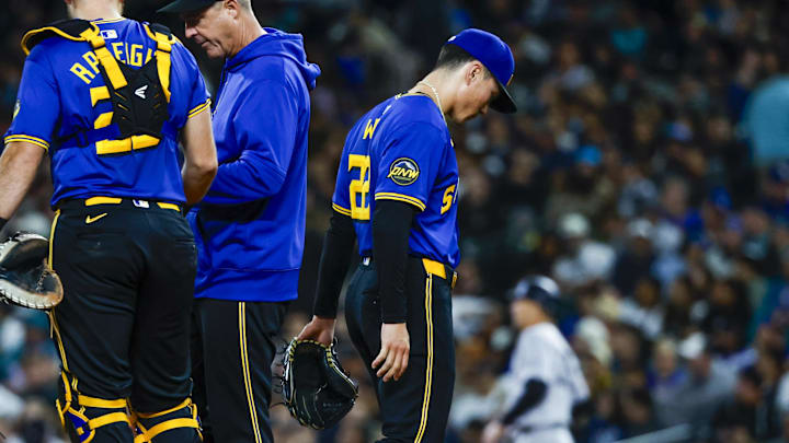 Seattle Mariners starting pitcher Bryan Woo (right) walks to the dugout after being taken out of a game against the New York Yankees on Tuesday at T-Mobile Park.