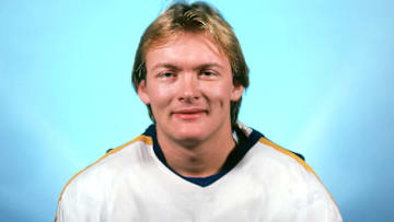 A young Lindy Ruff smiling as a member of the Buffalo Sabres