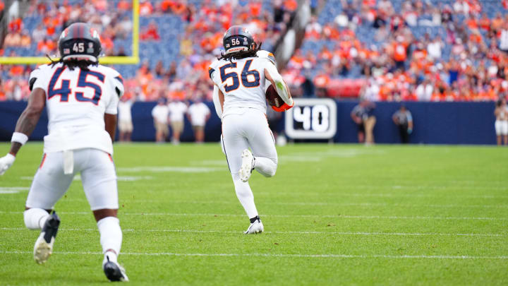 Aug 25, 2024; Denver, Colorado, USA; Denver Broncos linebacker Levelle Bailey (56) returns a interception for six points in the fourth quarter against the Arizona Cardinals at Empower Field at Mile High. 