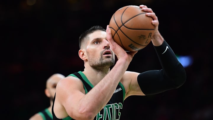 Feb 6, 2026; Boston, Massachusetts, USA;  Boston Celtics center Nikola Vucevic (4) shoots a free throw during the second half against the Miami Heat at TD Garden. Mandatory Credit: Bob DeChiara-Imagn Images