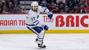 Feb 10, 2024; Ottawa, Ontario, CAN; Toronto Maple Leafs defenseman Timothy Liljegren (37) skates with the puck in the first period against the Ottawa Senators at the Canadian Tire Centre. Mandatory Credit: Marc DesRosiers-Imagn Images