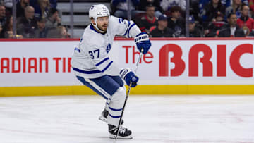 Feb 10, 2024; Ottawa, Ontario, CAN; Toronto Maple Leafs defenseman Timothy Liljegren (37) skates with the puck in the first period against the Ottawa Senators at the Canadian Tire Centre. Mandatory Credit: Marc DesRosiers-Imagn Images