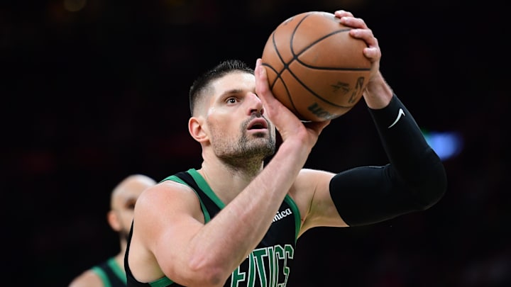 Feb 6, 2026; Boston, Massachusetts, USA;  Boston Celtics center Nikola Vucevic (4) shoots a free throw during the second half against the Miami Heat at TD Garden. Mandatory Credit: Bob DeChiara-Imagn Images