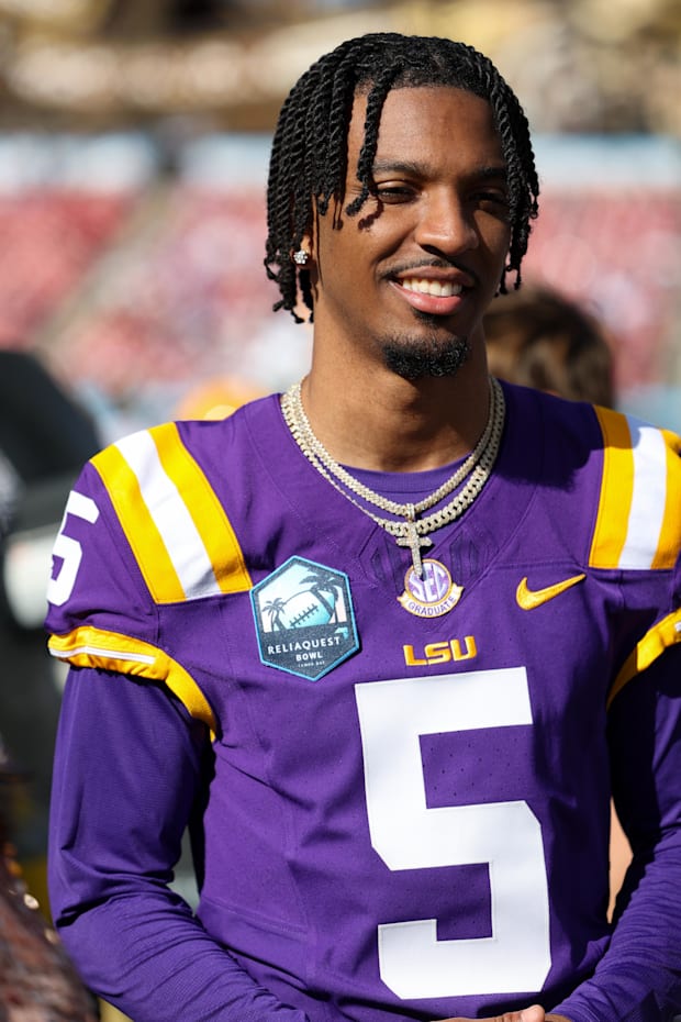 LSU Tigers quarterback Jayden Daniels looks on from the sidelines against the Wisconsin Badgers LSU Tigers quarterback Jayden Daniels looks on from the sidelines against the Wisconsin Badgers