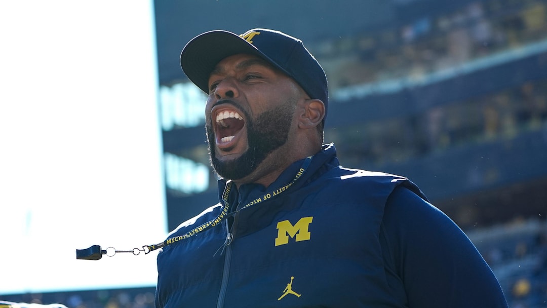 Michigan head coach Sherrone Moore cheers on during warm up before the Oregon game at Michigan Stadium in Ann Arbor on Saturday, Nov. 2, 2024.