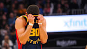 Jan 5, 2025; San Francisco, California, USA; Golden State Warriors guard Stephen Curry (30) wipes sweats off his forehead with his jersey during the third quarter against the Sacramento Kings  at Chase Center. Mandatory Credit: Kelley L Cox-Imagn Images