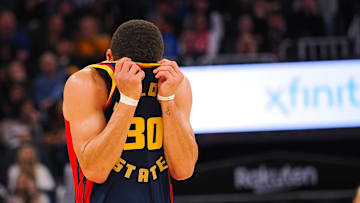 Jan 5, 2025; San Francisco, California, USA; Golden State Warriors guard Stephen Curry (30) wipes sweats off his forehead with his jersey during the third quarter against the Sacramento Kings  at Chase Center. Mandatory Credit: Kelley L Cox-Imagn Images