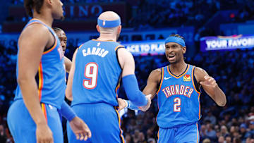 Jan 23, 2025; Oklahoma City, Oklahoma, USA; Oklahoma City Thunder guard Shai Gilgeous-Alexander (2) celebrates with guard Alex Caruso (9) after a basket against the Dallas Mavericks during the second half at Paycom Center. Mandatory Credit: Alonzo Adams-Imagn Images
