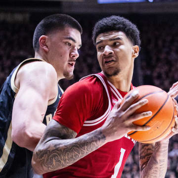 Feb 10, 2024; West Lafayette, Indiana, USA; Indiana Hoosiers center Kel'el Ware (1) moves to shoot the ball while Purdue Boilermakers center Zach Edey (15) defends in the first half at Mackey Arena. Mandatory Credit: Trevor Ruszkowski-USA TODAY Sports