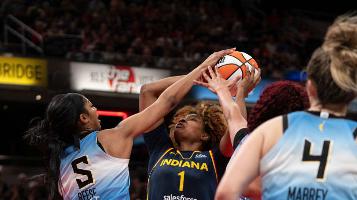 Indiana Fever forward NaLyssa Smith (1) attempts a layup while being guarded by Chicago Sky forward Angel Reese (5) on Sunday June 16, 2024, during the game at Gainbridge Fieldhouse in Indianapolis. The Fever beat the Sky 91-83.