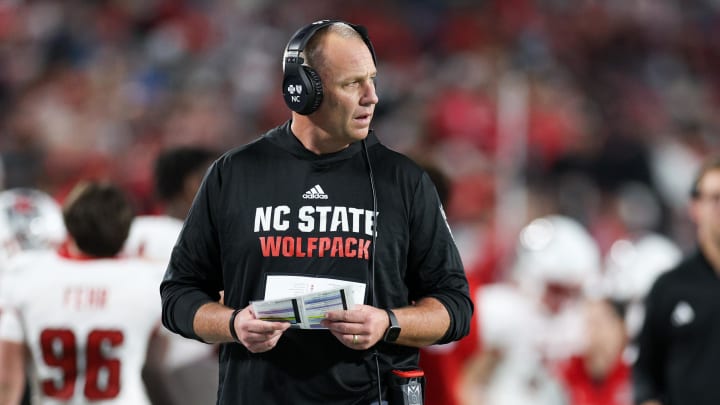 Dec 28, 2023; Orlando, FL, USA;  North Carolina State Wolfpack head coach Dave Doeren looks on from the sidelines during the Pop-Tarts bowl against Kansas State Wildcats in the fourth quarter at Camping World Stadium. Mandatory Credit: Nathan Ray Seebeck-USA TODAY Sports